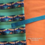 Oranje voering + petrol tassenband